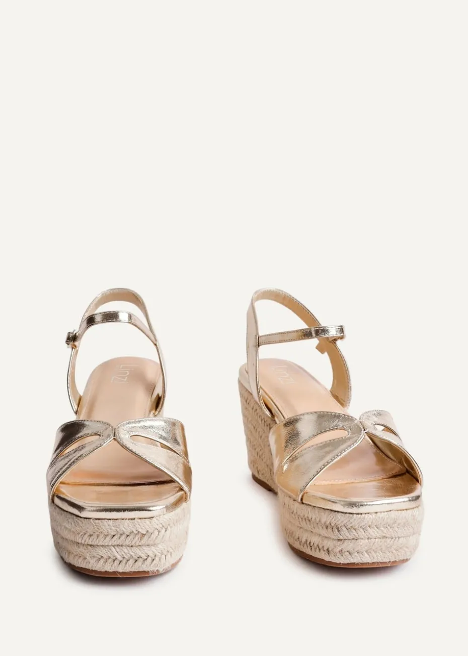Linzi Sian Wide Fit Gold Faux Leather Linked Design Wedges